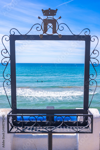 Obraz na płótnie Decorative frame showcasing the mediterranean sea and roc de sant gaieta near comarruga w salonie