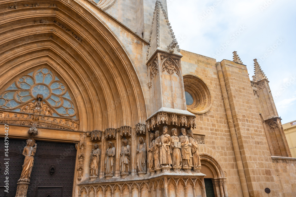 Tarragona cathedral main entrance showing stone sculptures and architectural details