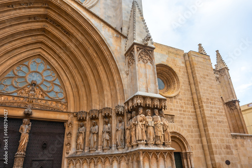 Obraz na płótnie Tarragona cathedral main entrance showing stone sculptures and architectural details w salonie