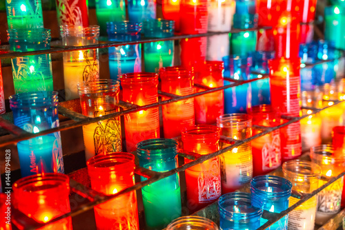 Obraz na płótnie Burning votive candles illuminating montserrat monastery rack w salonie