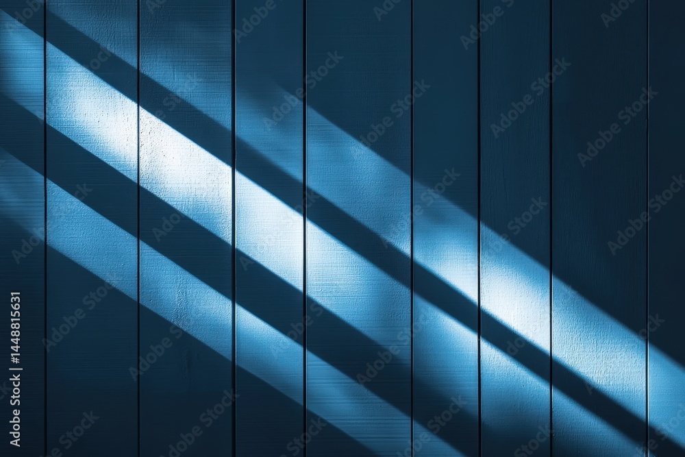 Fototapeta premium Sunlit Shadows Creating Stripes on Blue Wall and Wooden Floor
