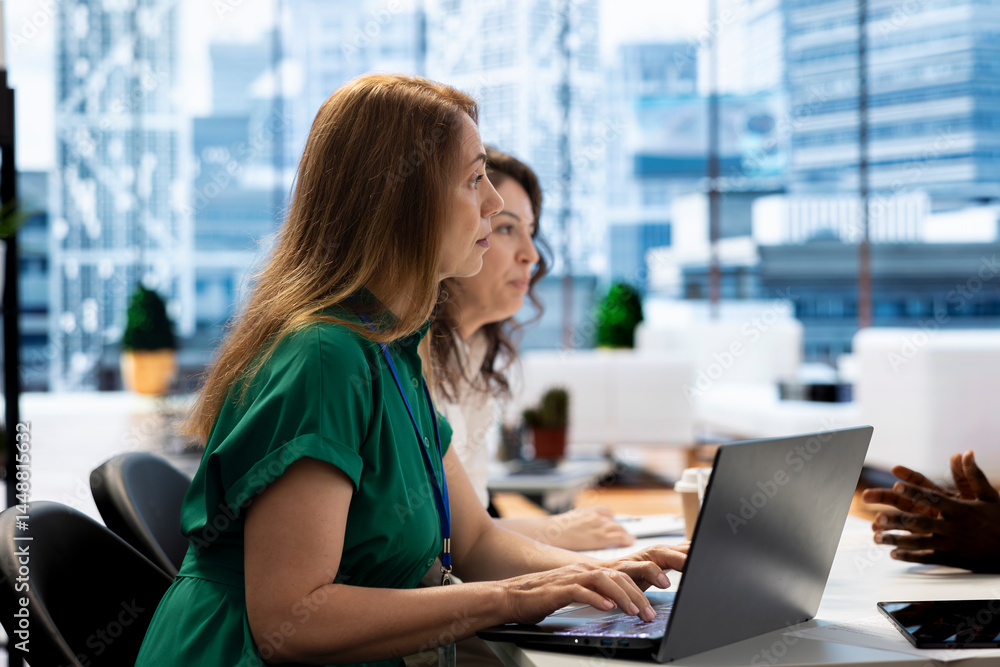 Team of HR professionals reviewing candidate CV, asking questions about qualifications. Person getting hired by headhunting coworkers after proving skills for financial business company job
