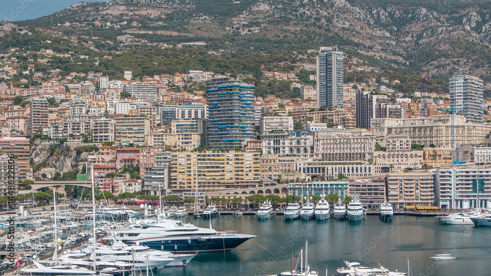 Obraz premium Monte Carlo city aerial panorama timelapse. View of luxury yachts and apartments in harbor of Monaco, Cote d'Azur.