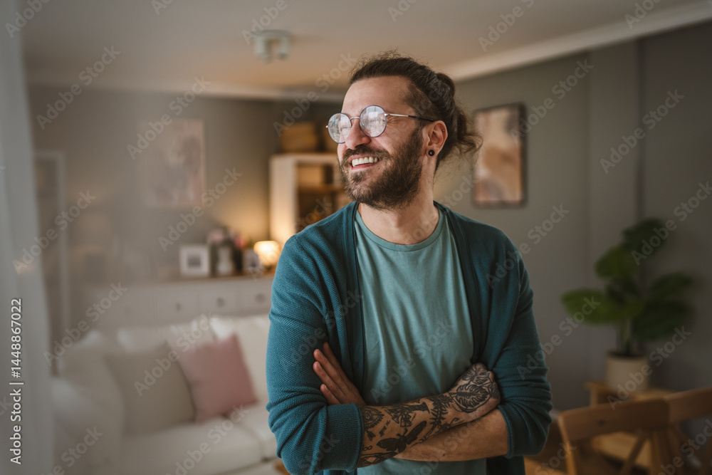 Portrait of adult men with eyeglasses beard and tattoos home happy Portrait of adult men with eyeglasses beard and tattoos home happy