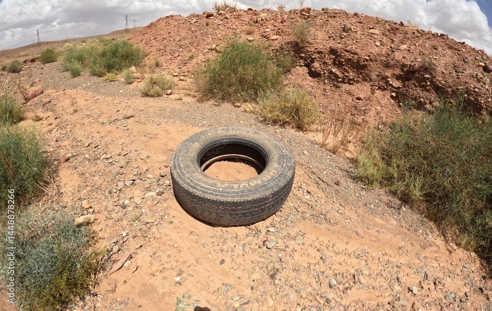An abandoned black tire in the desert An abandoned black tire in the desert