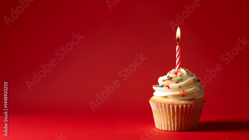 Birthday cupcake with candle on red background. Celebration theme