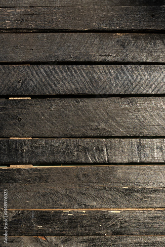 Old wooden fence pattern colored of dark brown. Wood background. Wood texture painted violet closeup. Vintage wooden background in Brazil