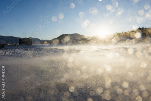 Snow on Lens with Blowing Snow at Sunrise