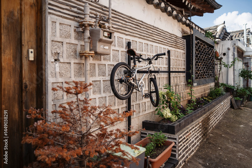Bicycle mounted on a facade wall of old Korean house