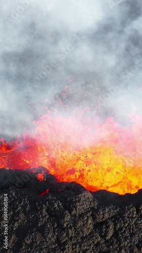 Wallpaper Mural Vertical Screen: Volcano Eruption, Flowing Red Hot Lava Erupts from Crater, Incredible Natural Phenomena, Spectacular Dramatic Scenery in Iceland, Shot for Social Media Torontodigital.ca