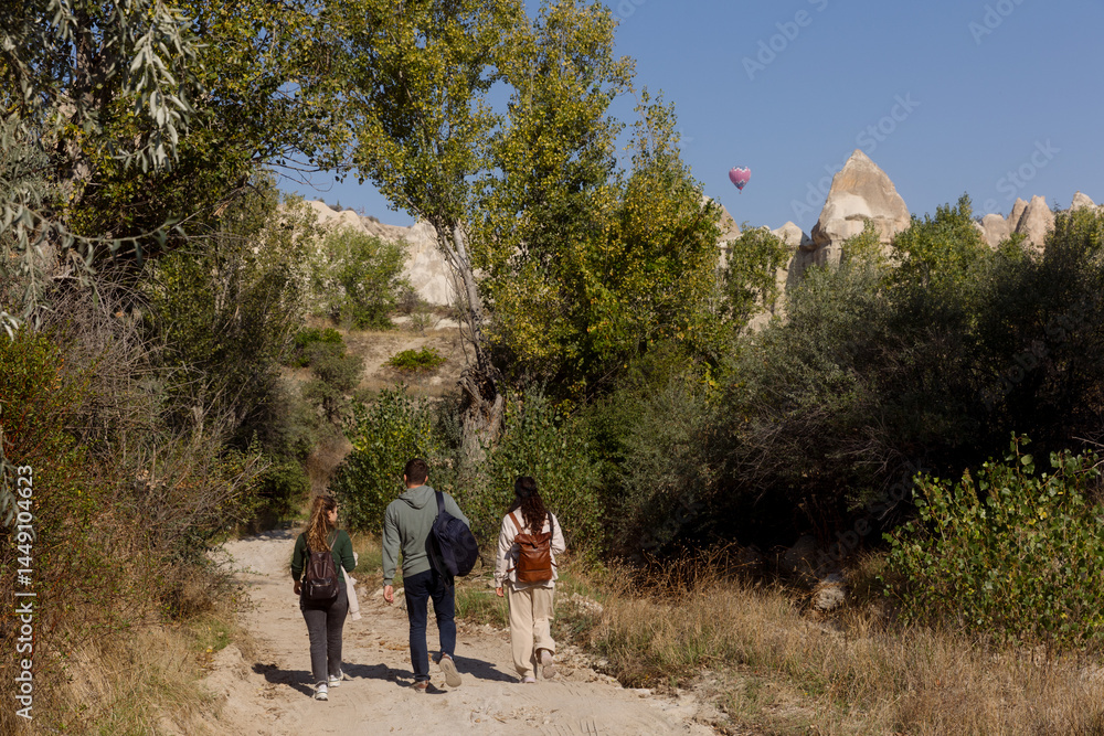 a group of young people walking in Cappadocia a group of young people walking in Cappadocia