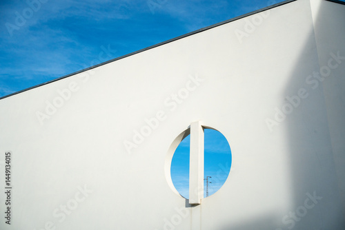 Modern white building with circular cutout