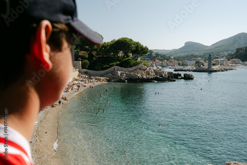 View  of the town of Cassis, France.  teen boy in forefront 