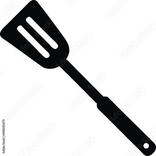 Isolated black spatula displays a smooth surface and three distinct slots across its flat end