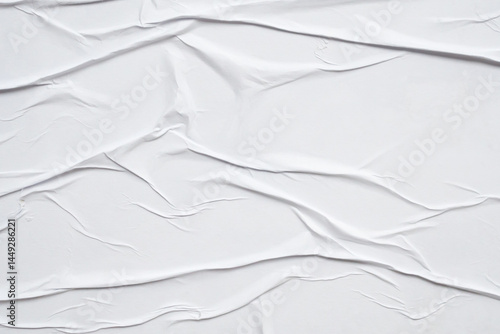 white crumpled and creased glued wrinkled paper poster texture background