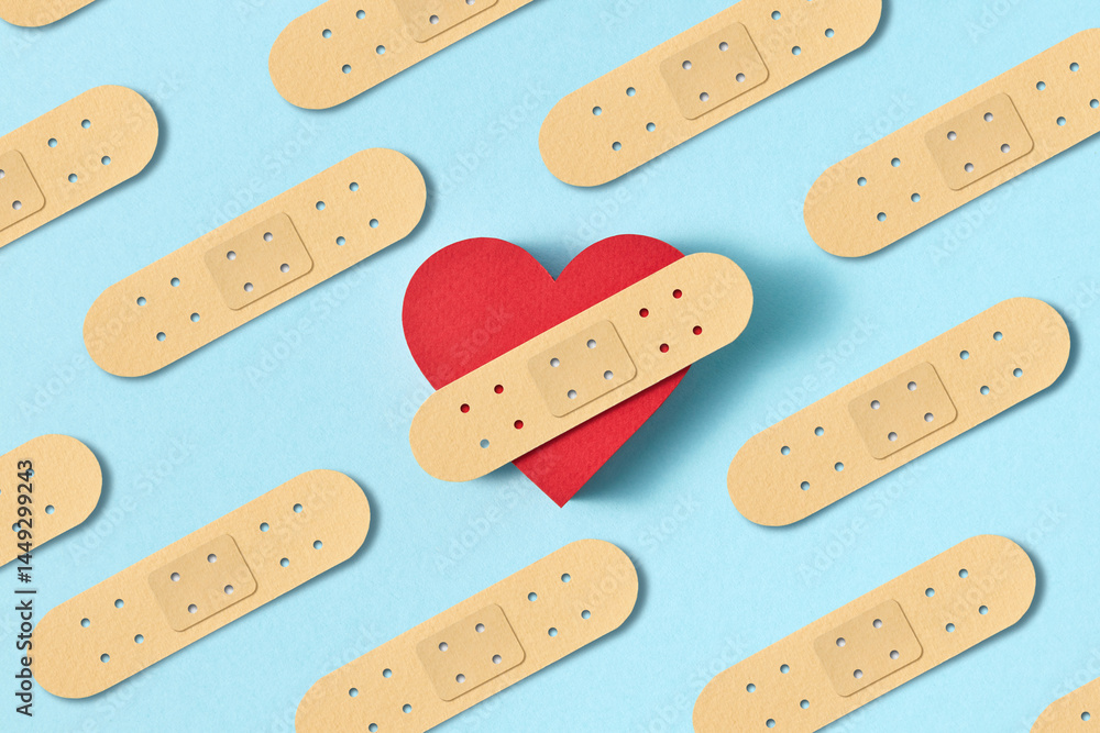 Papercraft figure of red heart with plaster strip. Papercraft figure of red heart with plaster strip.