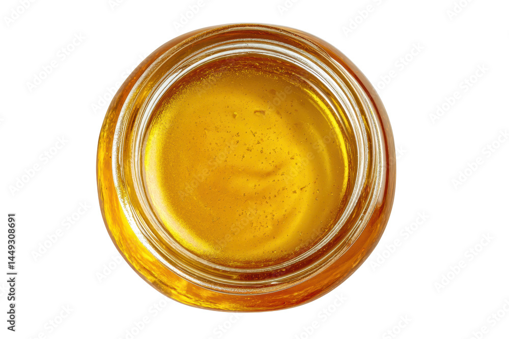 Top view of golden honey in a glass jar, cut out Top view of golden honey in a glass jar, cut out
