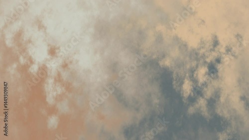 Cloudy sky in shades of tan and gray, ideal for background use in designs focusing on a moody or serene atmosphere.