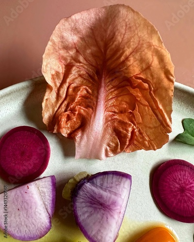 A delicious dish is perfectly styled on a soft pink background, creating a visually appealing image that blends food artistry with pastel aesthetic charm.

