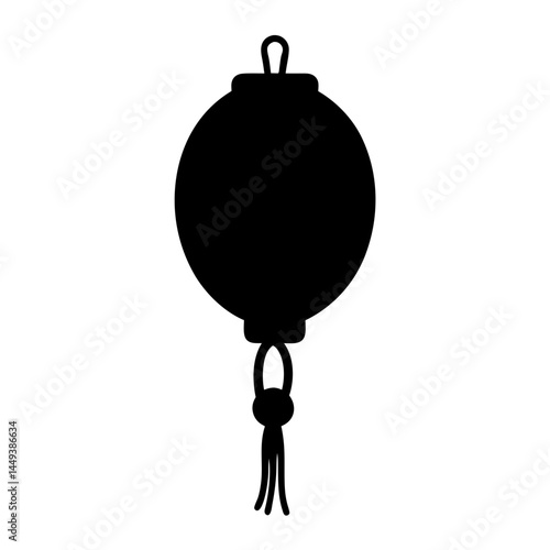 Silhouette of a traditional Asian hanging lantern with decorative tassels
