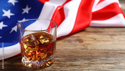 Glass of Whiskey and American Flag on Wooden Table, Space for Text