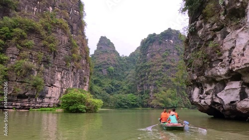 Trang An River Ninh Minh and Bai Dinh Mountain ranges in Vietnam only 3 hours drive from Hanoi. Beautiful winding river and large rising mountains. boats going through the caves in the river