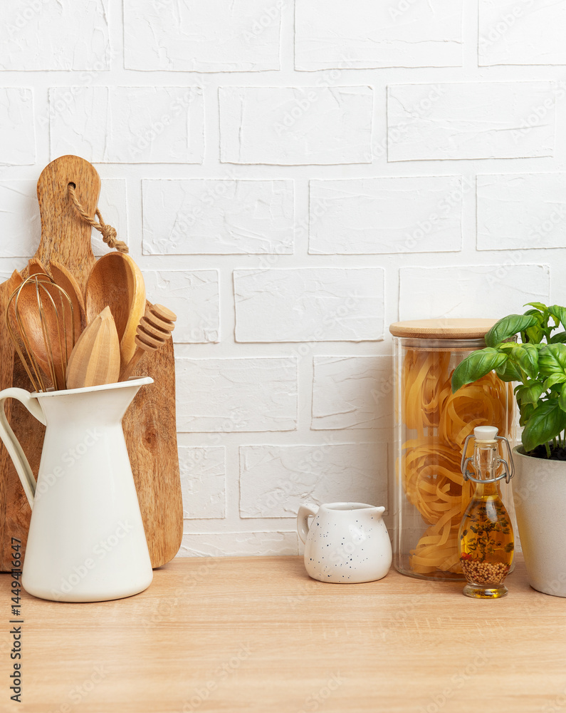 Kitchen utensils, pasta and basil showing rustic cooking and healthy food concept