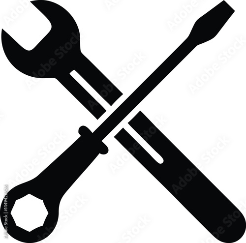 Black wrench and screwdriver are crossed in simple vector, presented on transparent backdrop