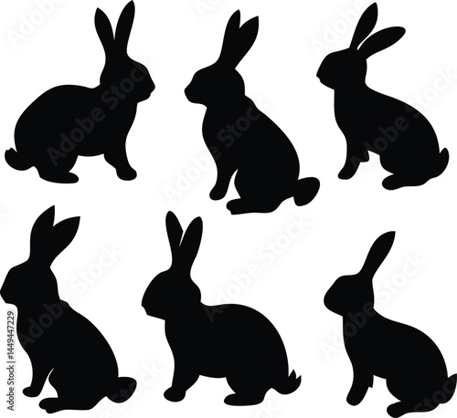 Six cute rabbits sit together as dark silhouettes upon the transparent background
