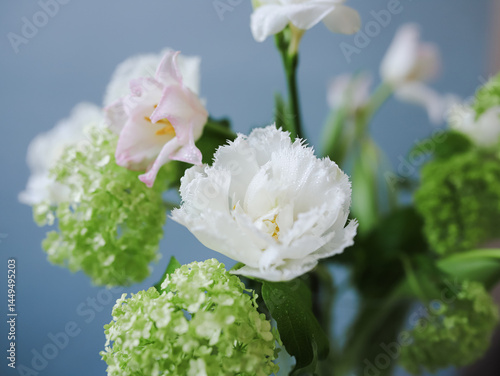 Closeup of fresh white flowers with dewdrops in bouquet