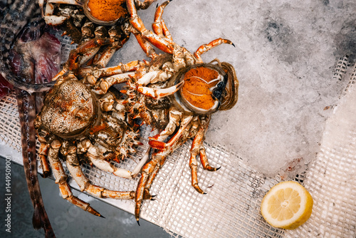 Fresh crabs on ice at seafood market