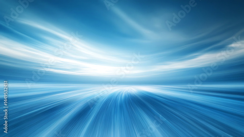 Abstract blue sky background with dynamic motion and blurred clouds on the horizon creating depth