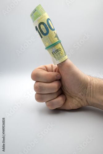 Obraz na płótnie European currency, rolled up banknotes, hand sign, positive meaning, OK.
w salonie