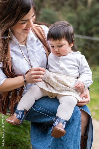 Venezuelan immigrant mother holding her baby daughter