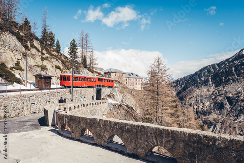 Discover the scenic viewpoint and panoramic views of the Montenvers Mer de Glace and Mont Blanc mountains, and the red train in Chamonix, Haute-Savoie, France.