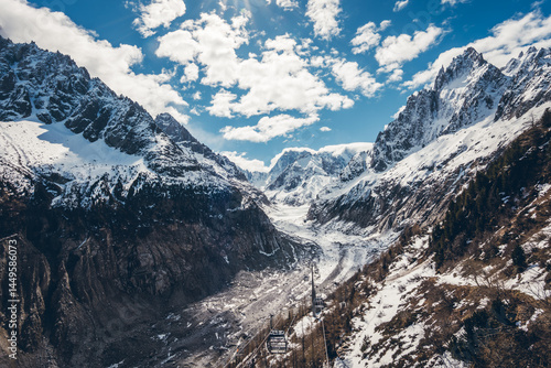 Discover the scenic viewpoint and panoramic views of the Montenvers Mer de Glace and Mont Blanc mountains, and the red train in Chamonix, Haute-Savoie, France.