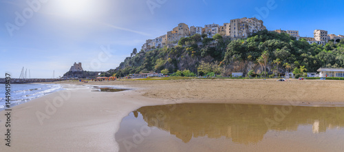 Fototapeta Naklejka Na Ścianę i Meble -  Townscape of Sperlonga in Lazio, Italy: view from the sandy beach of the old town perched on the promontory.