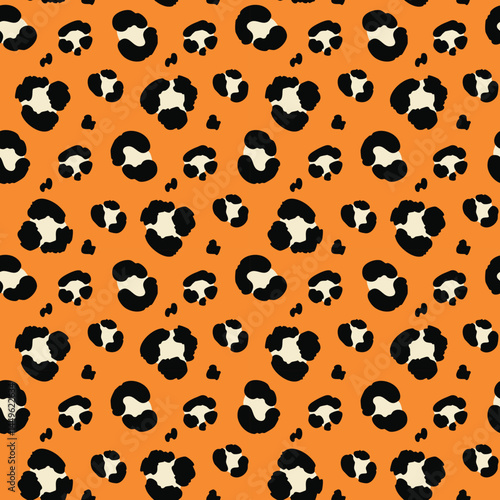 Leopard print pattern with black and white spots on an orange background, creating a bold and exotic design