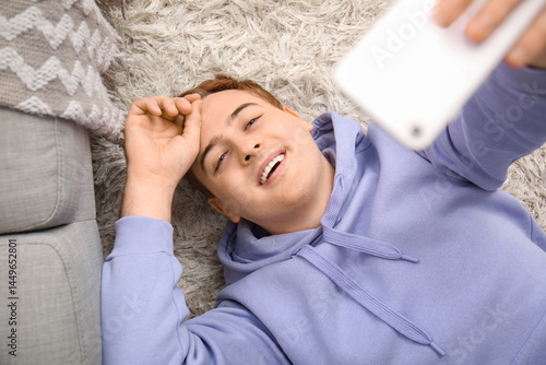Young man with mobile phone...