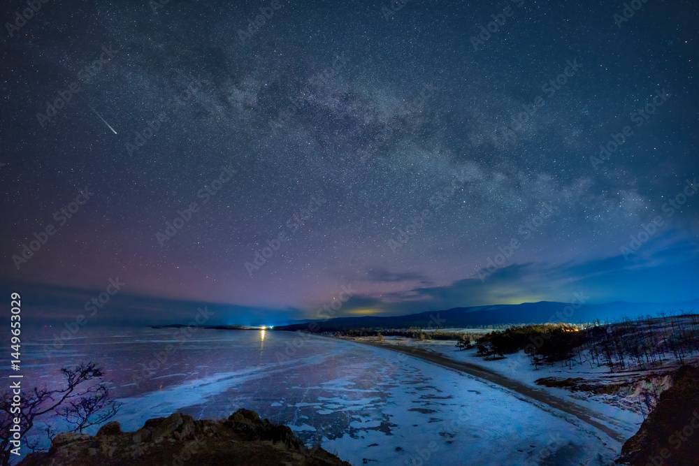 Naklejka premium Frozen lake and falling stars in winter night. Milky way and meteor stars over the Lake baikal, Siberia, Russia.
