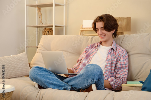 Male student studying with ...