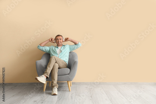 Old man sitting in armchair...