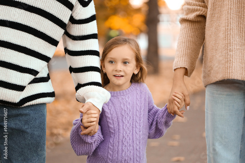 Happy family walking in bea...