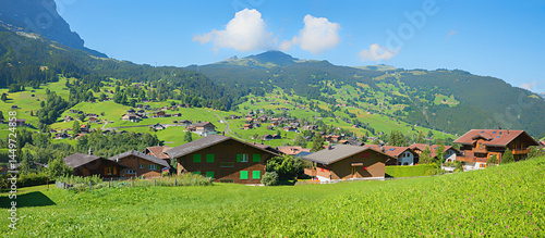 Obraz na płótnie Grindelwald village with traditional chalets at the green slope, Mannlichen mountain, switzerland w salonie