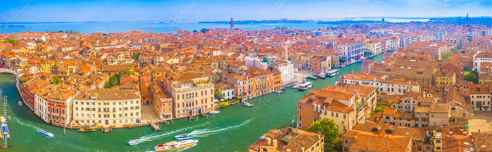 Fototapeta premium Panorama of stunning cityscape of Venice, Italy, featuring the iconic Grand Canal winding through the historic city, with elegant architecture and breathtaking palaces and bridges
