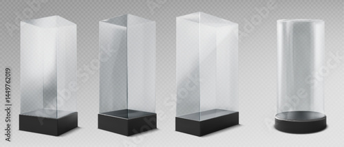 Glass museum display cases of varying heights and shape for exhibit. Rectangular and cylindrical transparent boxes with black bases for showcase artifacts and collectibles. Protect acrylic containers