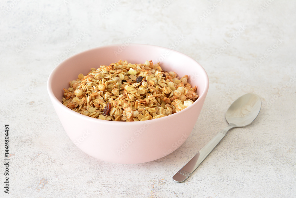 muesli in a Pink Bowl with a Spoon on marble background muesli in a Pink Bowl with a Spoon on marble background