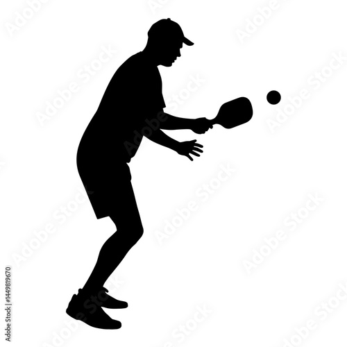 Player preparing for pickleball shot in silhouette, athletic focus