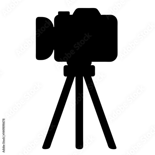 Black silhouette of a professional video camera on a tripod stand