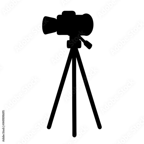 Silhouette of a professional video camera mounted on a sturdy tripod